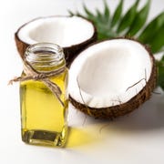 Coconut oil and fresh coconut on white background. coconut oil and fresh coconut on white background