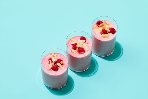 three glasses of pink coconut raspberry smoothie