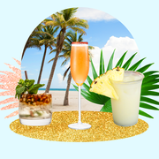 a blue background with palm leaves, a beach, and coconut cocktails