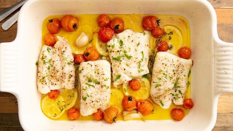 oven baked codfish in a white baking dish