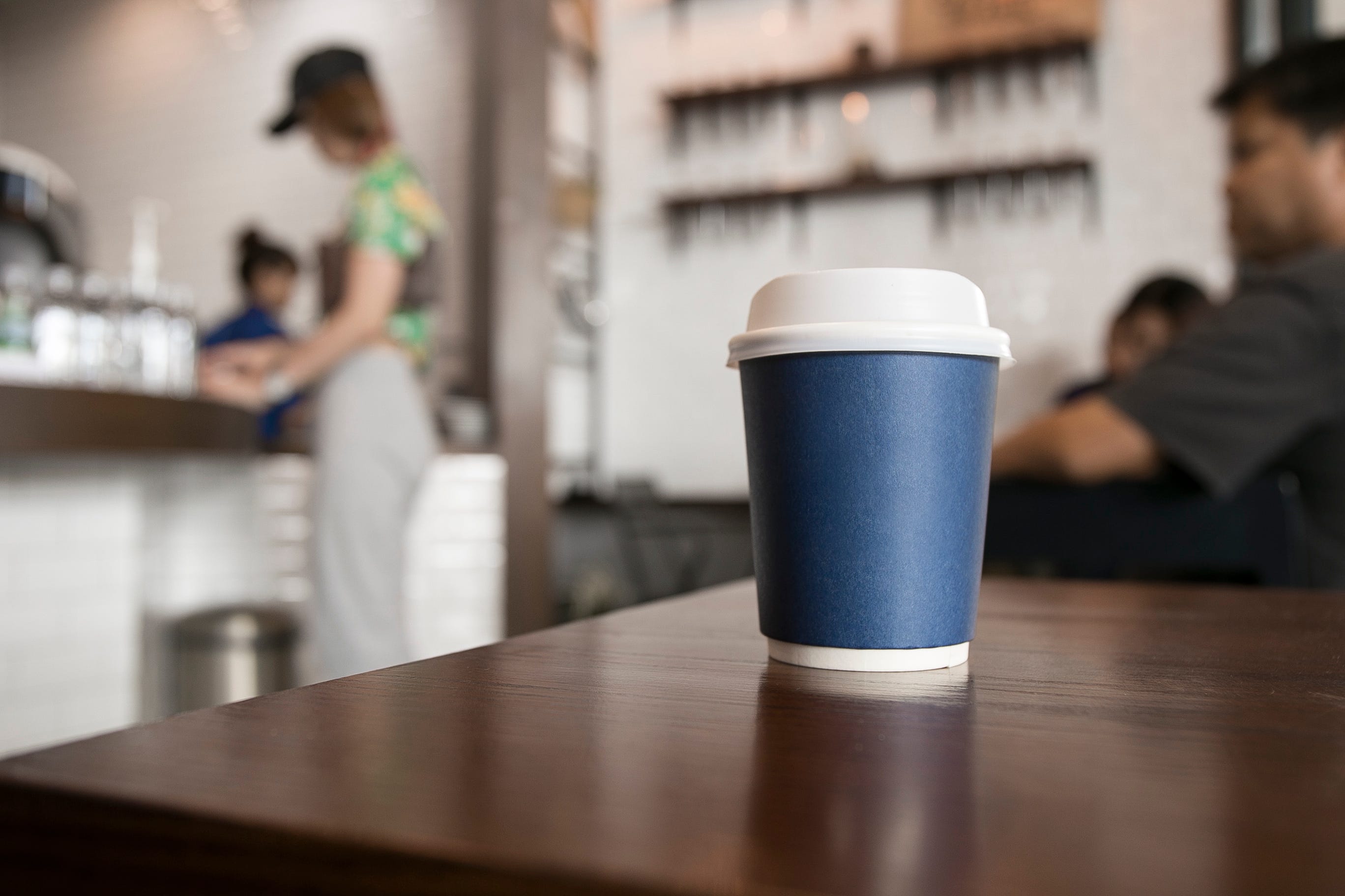 close up of coffee cup on table at cafe