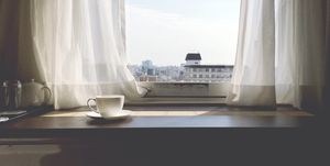 Coffee Cup On Table By Window At Home