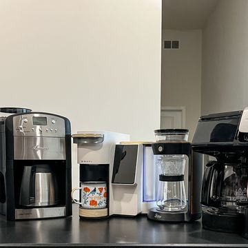 a kitchen counter with coffee makers