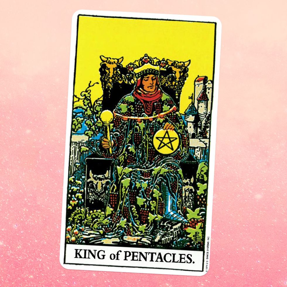 the tarot card the king of coins or pentacles, showing a king in a crown and patterned robes sitting on a throne and holding a sceptre and giant coin with a pentacle on it