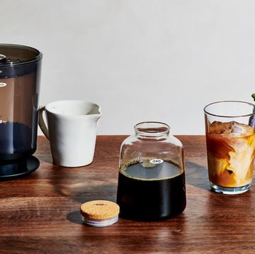 oxo cold brew coffee maker with glass of iced coffee