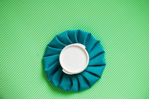 a flat lay of a green ice pack on a green background