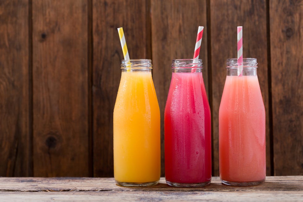 cold drinks in a botlles on wooden table