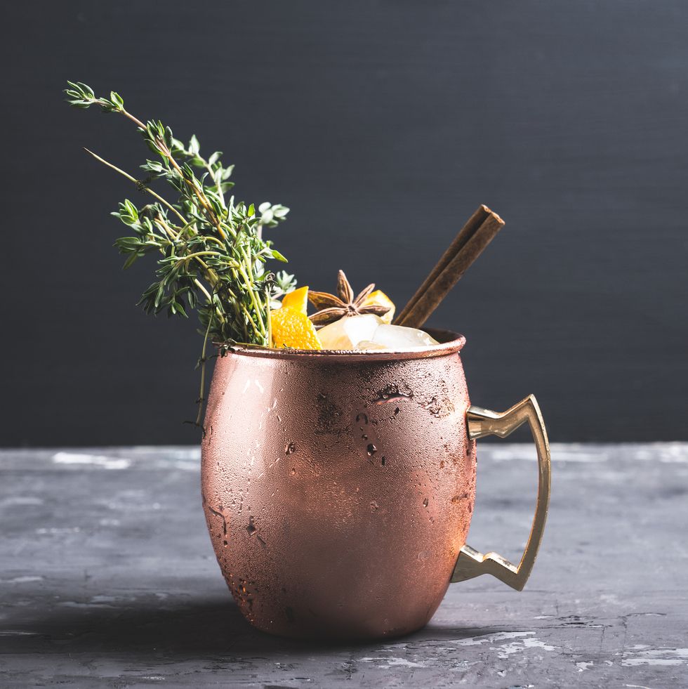 https://hips.hearstapps.com/hmg-prod/images/cold-orange-moscow-mule-cocktail-in-copper-mug-royalty-free-image-1663062929.jpg?crop=0.66635xw:1xh;center,top&resize=980:*
