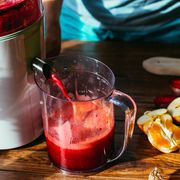 cold press juicer with oranges lemons and beets