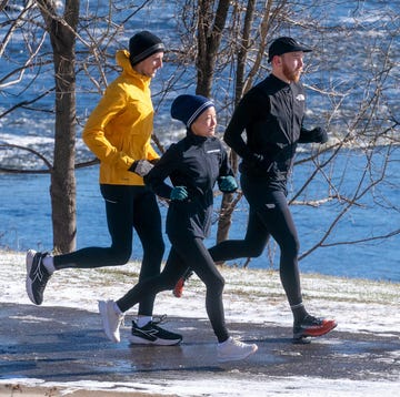 Group of three individuals jogging in a winter setting group of three individuals jogging in a winter setting