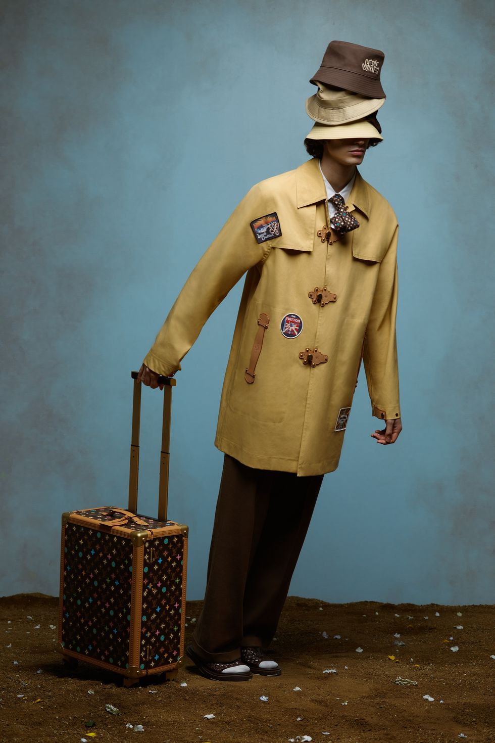 a person in a uniform holding a suitcase