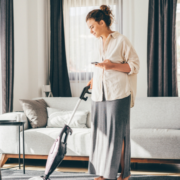 a woman using a vacuum