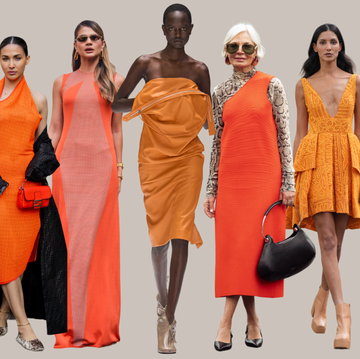 a group of people wearing orange dresses