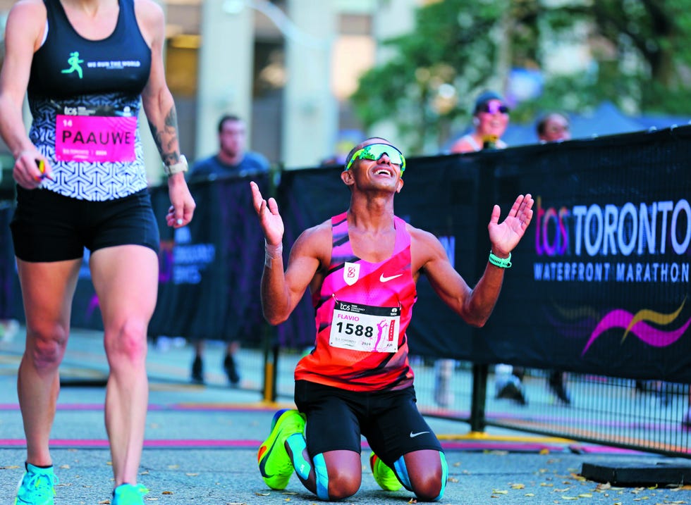 toronto, on october 20. a marathon runner kneels down on the ground after crossing the finish line. the toronto waterfront marathon took place on october 20. october 20 2024 (photo by michelle mengsu chang/toronto star via getty images)