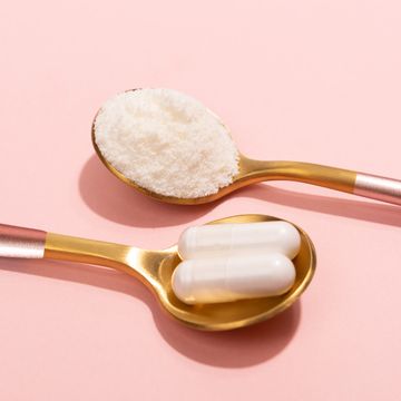 collagen powder and pills on pink background