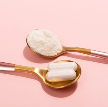 collagen powder and pills on pink background