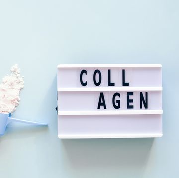 collagen powder in spoon and lightbox with text collagen nutritional supplement concept