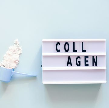 collagen powder in spoon and lightbox with text collagen nutritional supplement concept