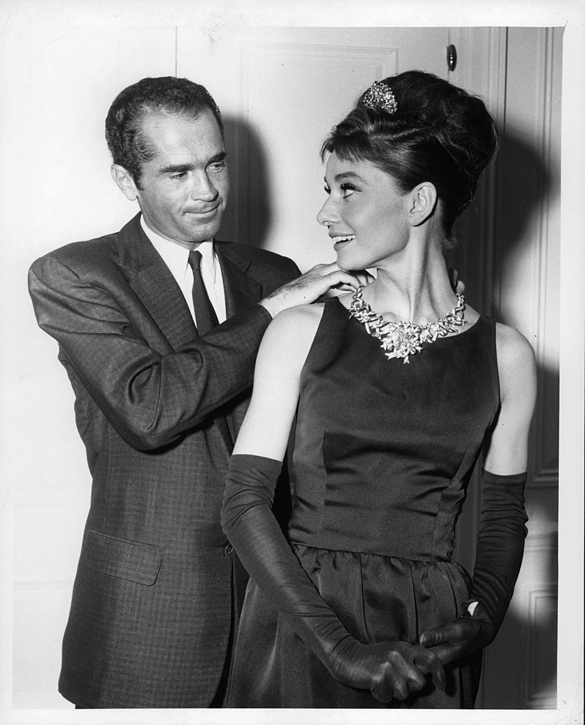 henry b platt, great grandson of the founder of tiffanys, adjusts audrey hepburns necklace to signal the start of production for the film breakfast at tiffanys, 1961 photo by paramountgetty images