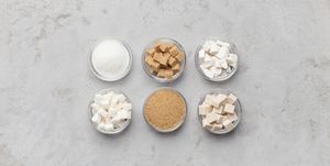 Collection of different kinds of sugar on gray background