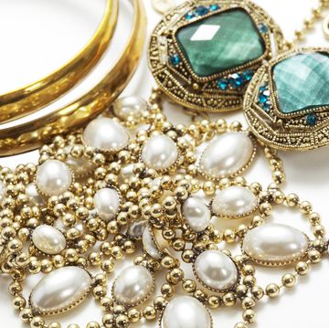 collection of vintage jewelry on white surface