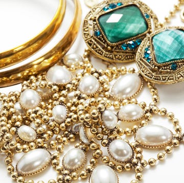 collection of vintage jewelry on white surface