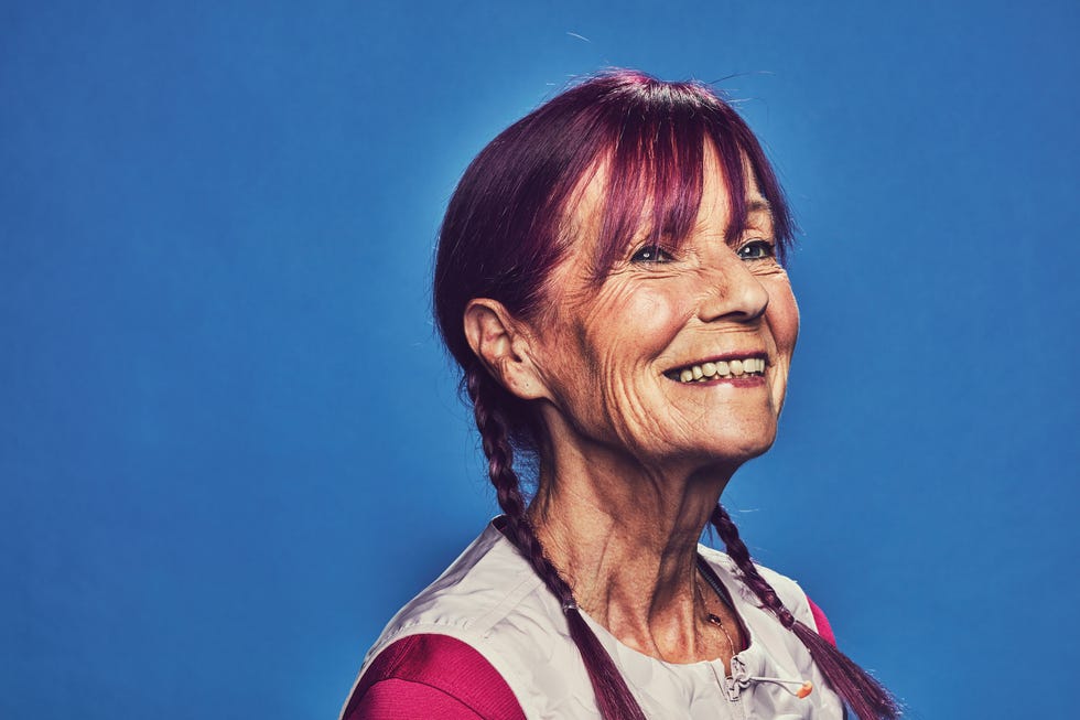 profile of a person with braided hair against a blue background