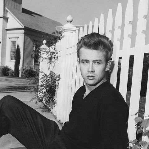 cal trask james dean sits on the ground leaning on a picket fence in a publicity still for east of eden photo by �� john springer collectioncorbiscorbis via getty images