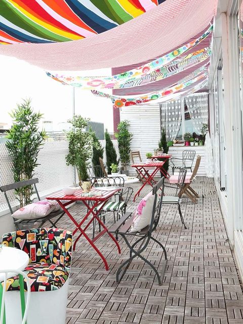 colorful fabric shade over patio furniture
