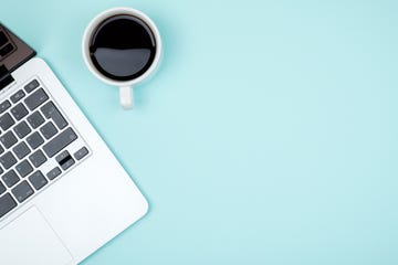 colored office desk table with computer and coffee