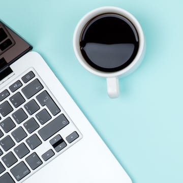 colored office desk table with computer and coffee