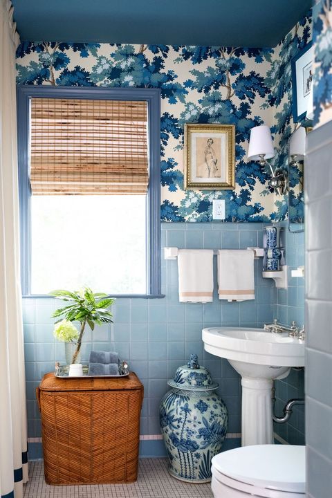 blue bathroom with wallpaper