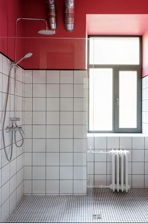 white tile bathroom with red painted ceiling