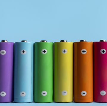 colorful batteries on blue background