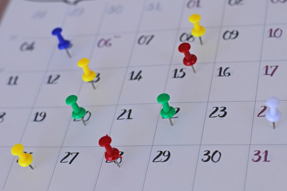 colorful pins on calendar