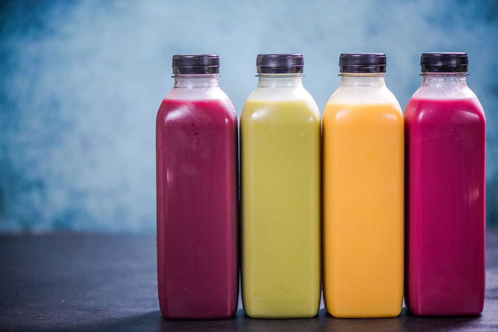 Colorful smoothies in plastic bottles