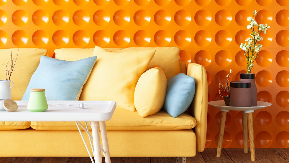 colorful sofa with geometric orange wall