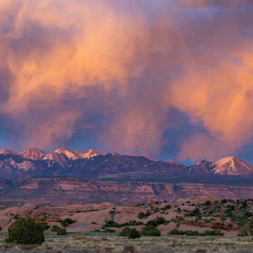 colorful sunset clouds over the la sal mountains near moab