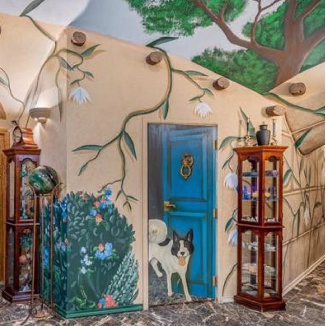 underground house with colorful murals painted on its walls and ceilings