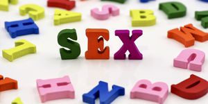 colorful wooden letters spelling out words sex