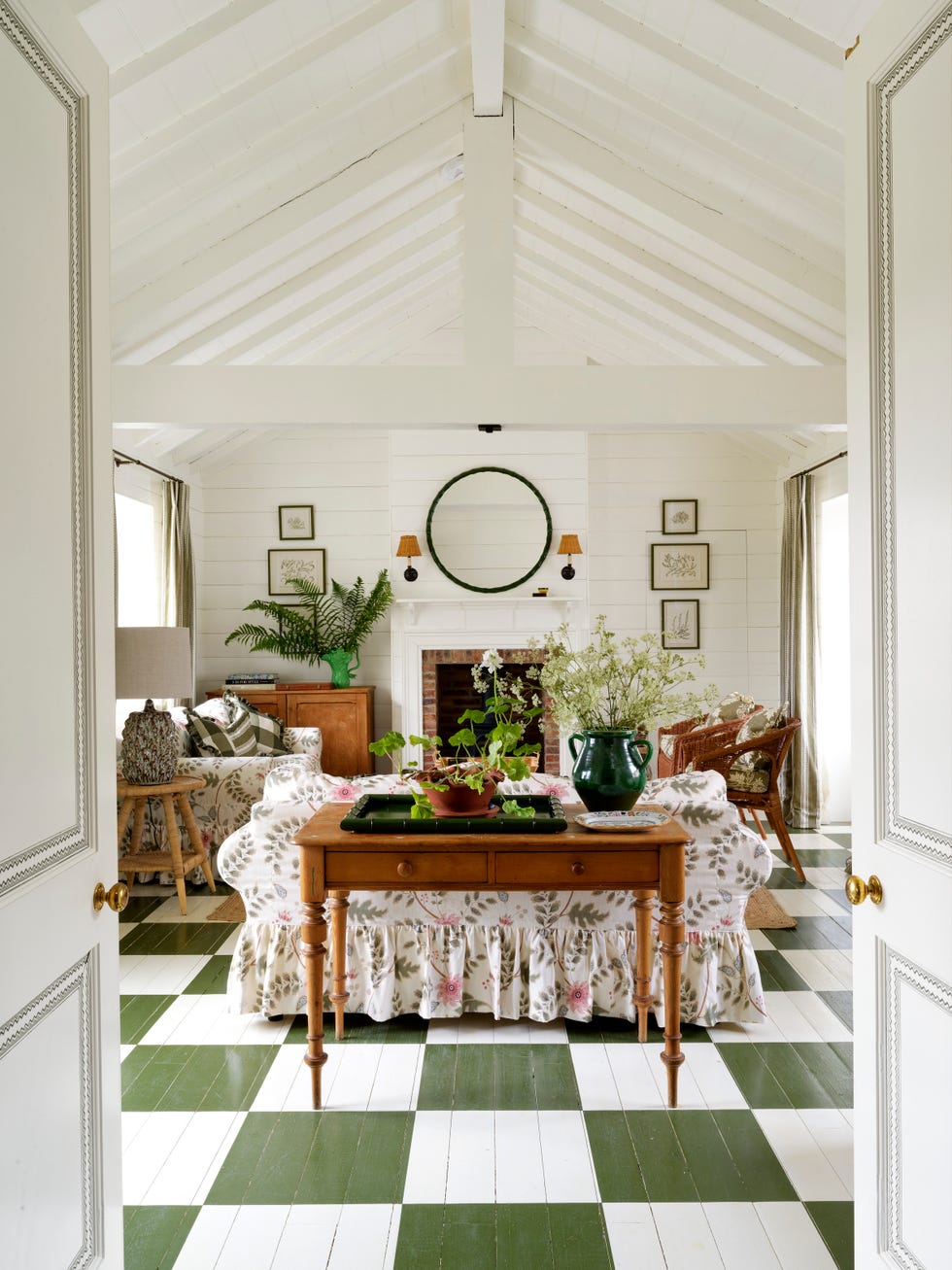 family room with green and white checkered floor and floral sofa