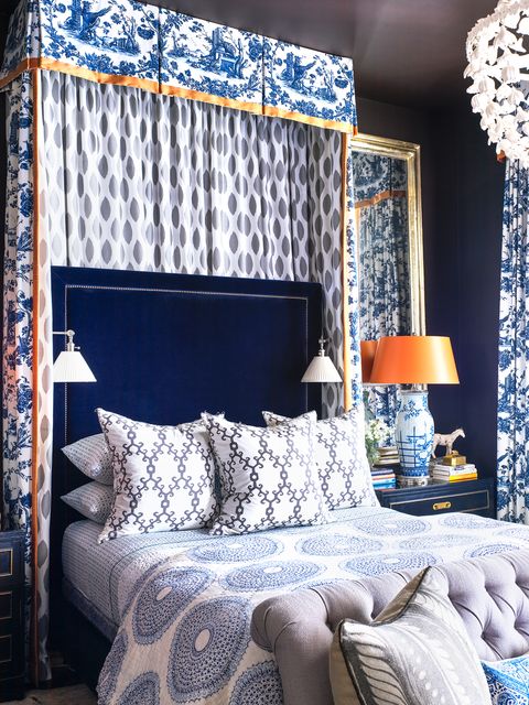 formal blue and white bedroom with canopy