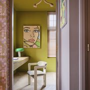 study
while deemed too harsh for a large room, this chartreuse paint a custom blend by ijm studio is perfect in pearce’s office, just off a lilac hall desk custom lamp flos art clients’ own