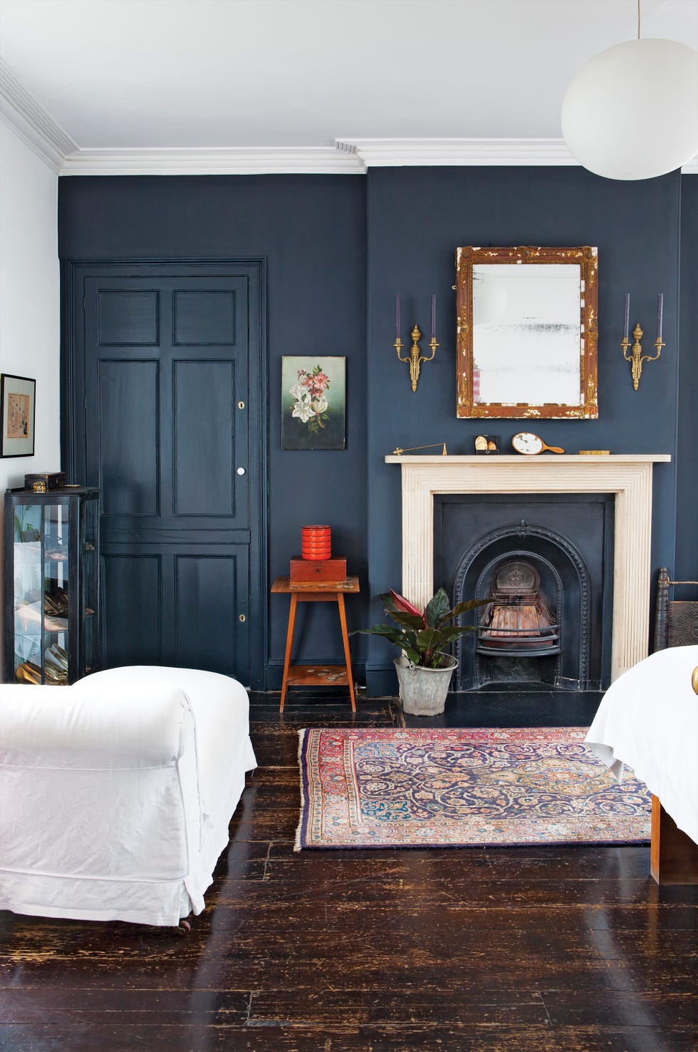 black bedroom with fireplace from homeowner sylvie morris, who has decorated this georgian townhouse in bristol