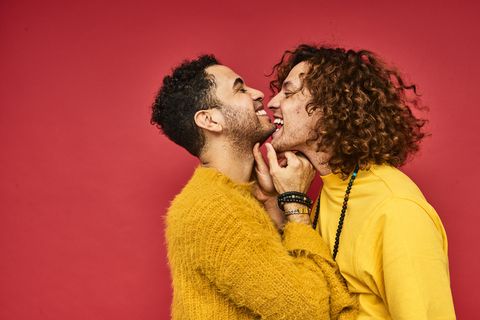 Colourful studio portrait of a gay male couple