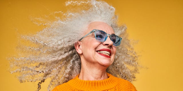 Colourful studio portrait of a senior woman