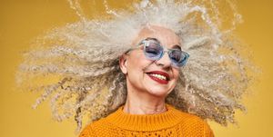 how to embrace and style gray hair colourful studio portrait of a senior woman