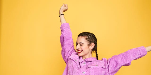 Colourful studio portrait of a young woman