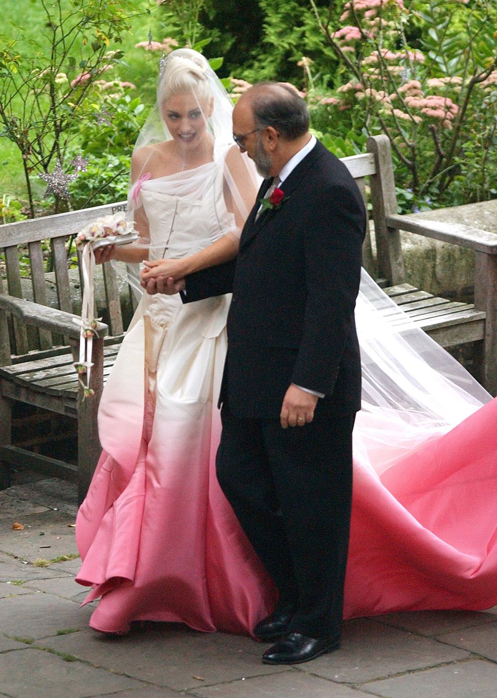 london, uk   september 9  gwen stefani with her father dennis stefani during the wedding ceremony of gwen stefani and gavin rossdale held on september 14, 2002 at st pauls cathedral in covent garden in london, england photo by james whatlinguk press via getty images