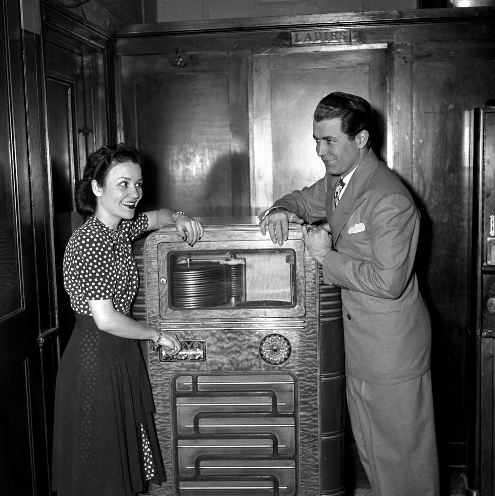 new york april 24: columbia records recording artist, singer bonnie baker with bandleader orrin tucker. they are playing a coin record player (jukebox). new york, ny. april 24, 1940. (photo by cbs via getty images)